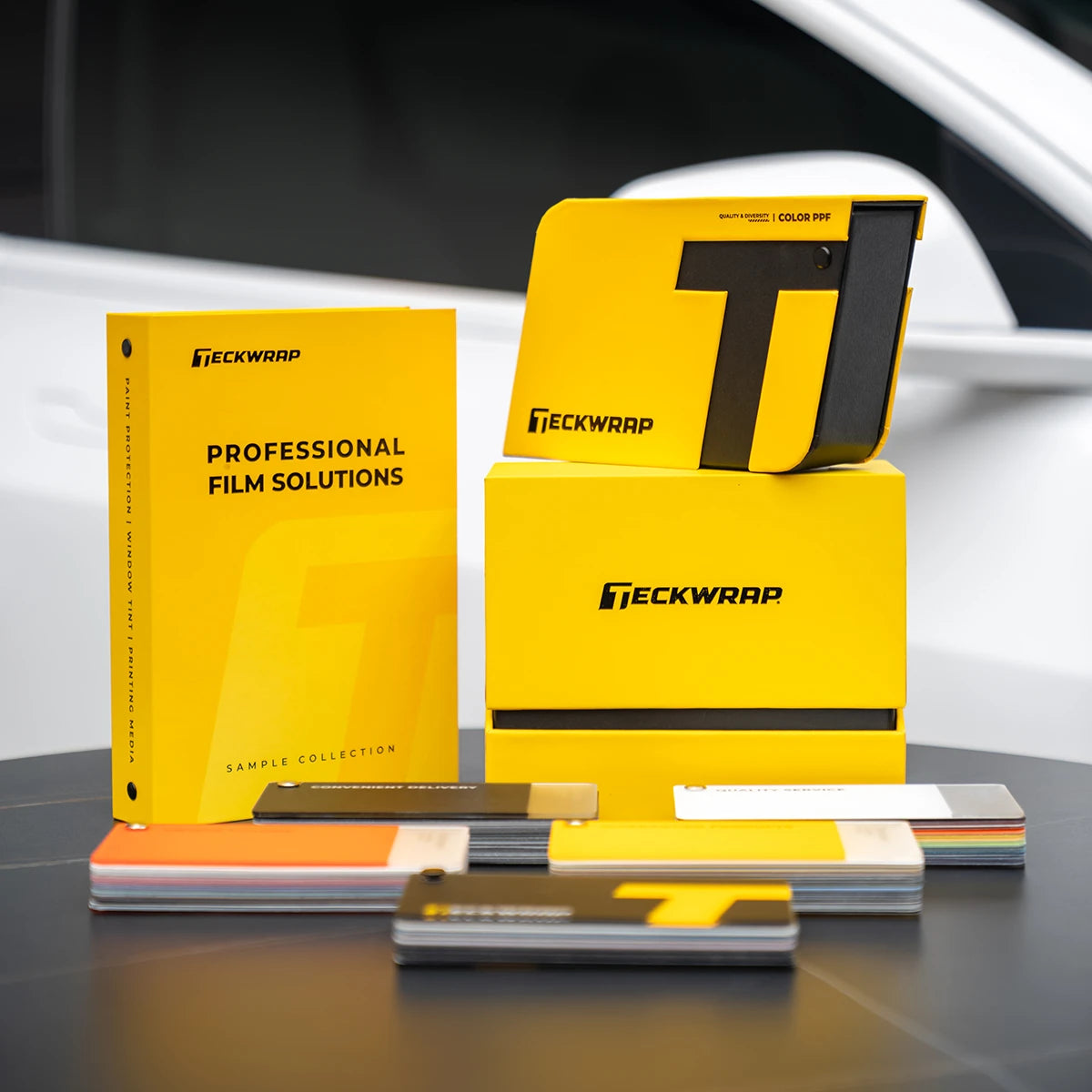 TeckWrap Swatches 2025 Set showing Color PPF sample book, vinyl swatch cards, and professional film solutions packaging