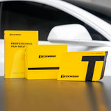 TeckWrap Swatches 2025 Set with yellow sample collection boxes displayed in front of a white car