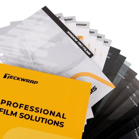 Close-up of TeckWrap Clear PPF and Window Film Sample Book showing window tint film pages and dark sample sheets