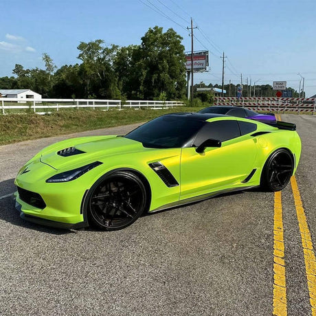 Chevrolet Corvette featuring TeckWrap Gloss Acid Lime (RB07-HD) vinyl wrap, highlighting its vibrant lime hue and sporty, high-gloss shine on the road.