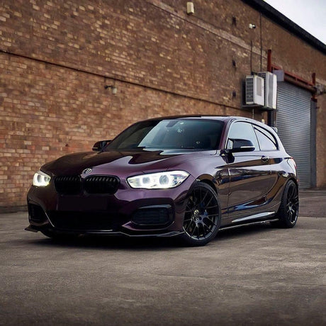 BMW sports car wrapped in TeckWrap Gloss Burgundy Black (HM10-HD) vinyl, accentuating its sophisticated burgundy-black gloss and sleek appearance.
