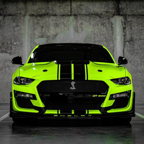 Front view of a Shelby Mustang wrapped with glossy Gecko Green (CG41-HD) TeckWrap vinyl, featuring bold black racing stripes for a dynamic and sporty appearance.