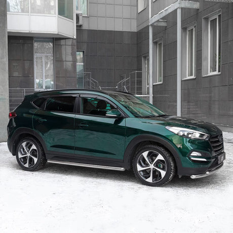 Side view of a car wrapped in TeckWrap Gloss Green Black (HM07-HD) vinyl, displaying its sophisticated, reflective dark green-black color against a vibrant mural backdrop.