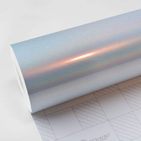 Close-up view of TeckWrap White Fireworks (RCH03-HD) Vinyl Wrap showcasing its glossy, iridescent finish with subtle rainbow hues for car customization.