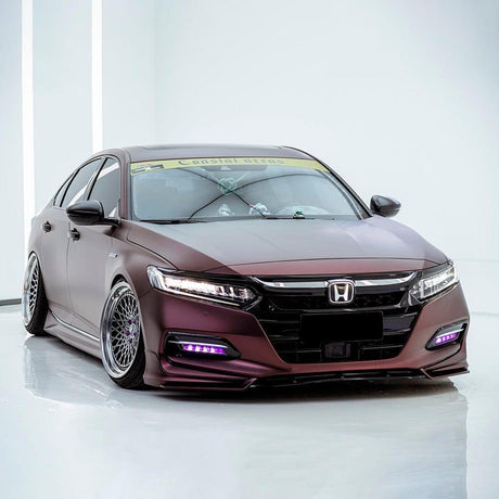 Studio shot of a Honda sedan wrapped in TeckWrap Satin Burnt Maroon (SMT02) Vinyl Wrap, emphasizing the stylish matte-maroon aesthetic and distinctive automotive styling.
