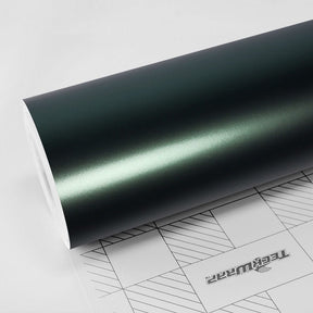 Close-up of TeckWrap Green Mantle (SMT05) satin vinyl wrap being held, showcasing its smooth texture and subtle satin sheen.
